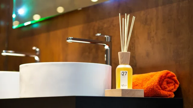 Modern bathroom lighting design with LED mirror lights and warm ambient interior decor